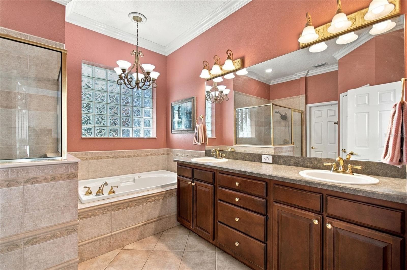 Primary ensuite has double sink vanity, soaking tub, separate shower, water closet and walk-in closet. - 4108 N FORBES RD, PLANT CITY