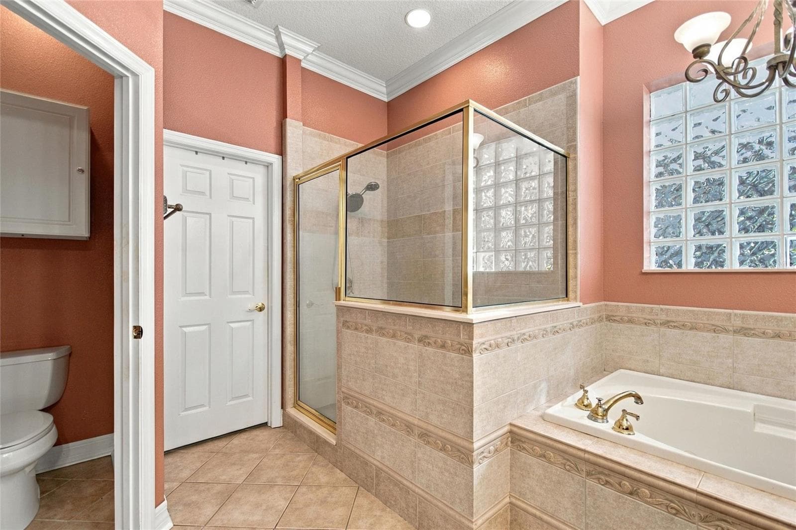 View of shower, water closet and tub.  The door opens to the walk-in closet. - 4108 N FORBES RD, PLANT CITY