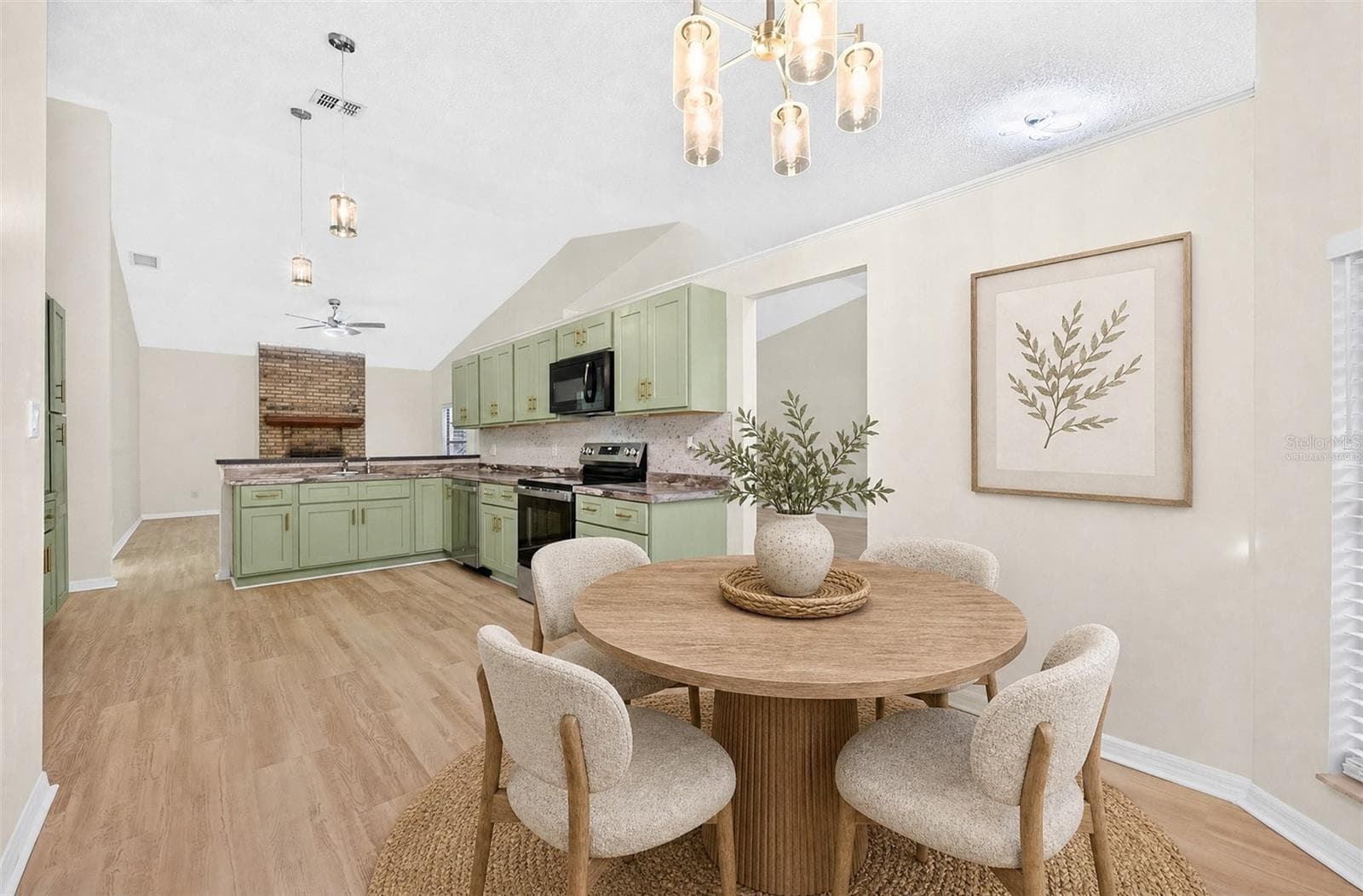 A sunny Breakfast Nook with its own ARCHED LUNETTE WINDOW provides a lovely spot for morning coffee. Virtually Staged - 1003 N MAGEE CREEK CT, OVIEDO