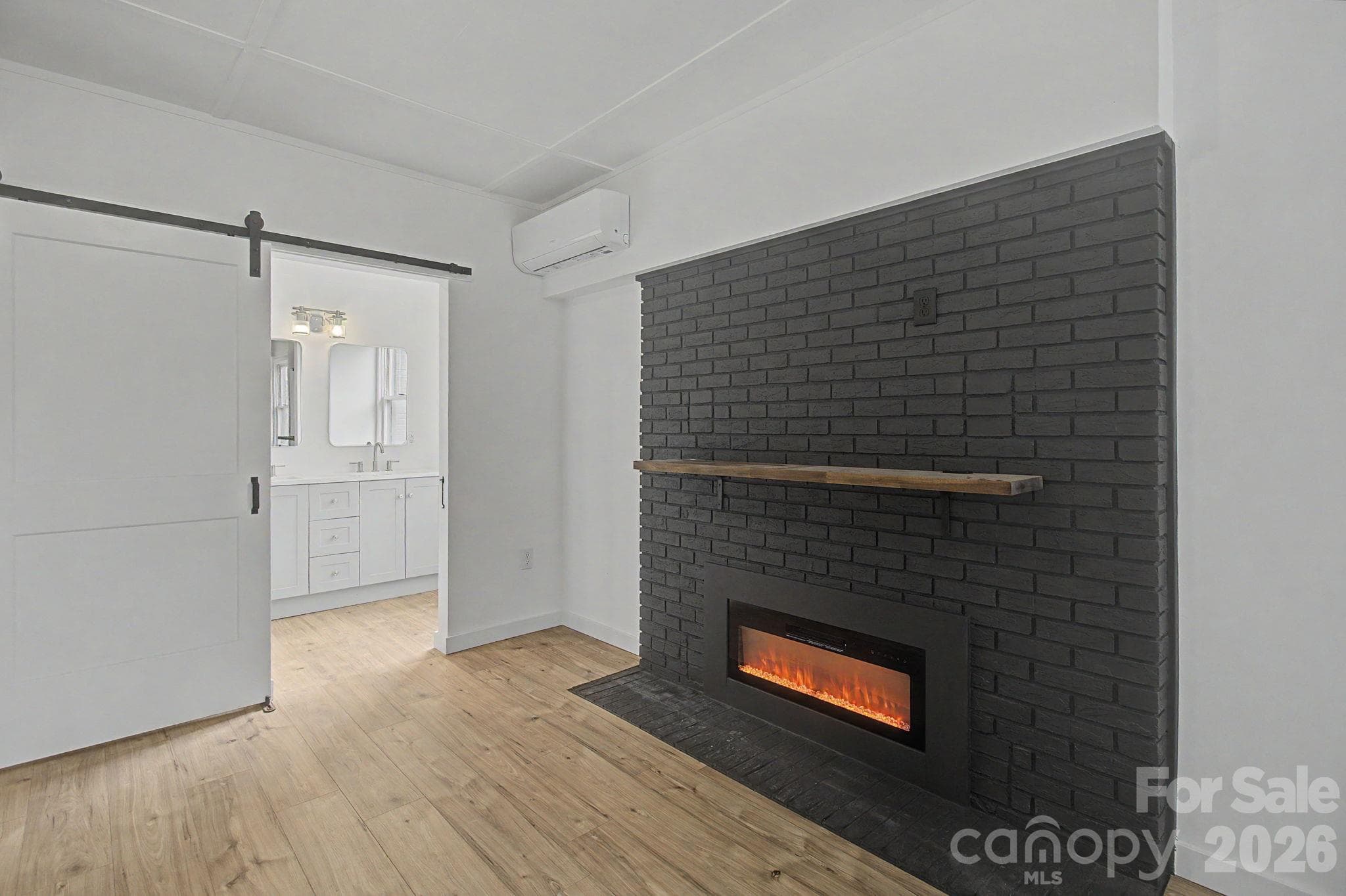 Electric fireplace in Primary Bedroom - 14 Kirby Place, Asheville