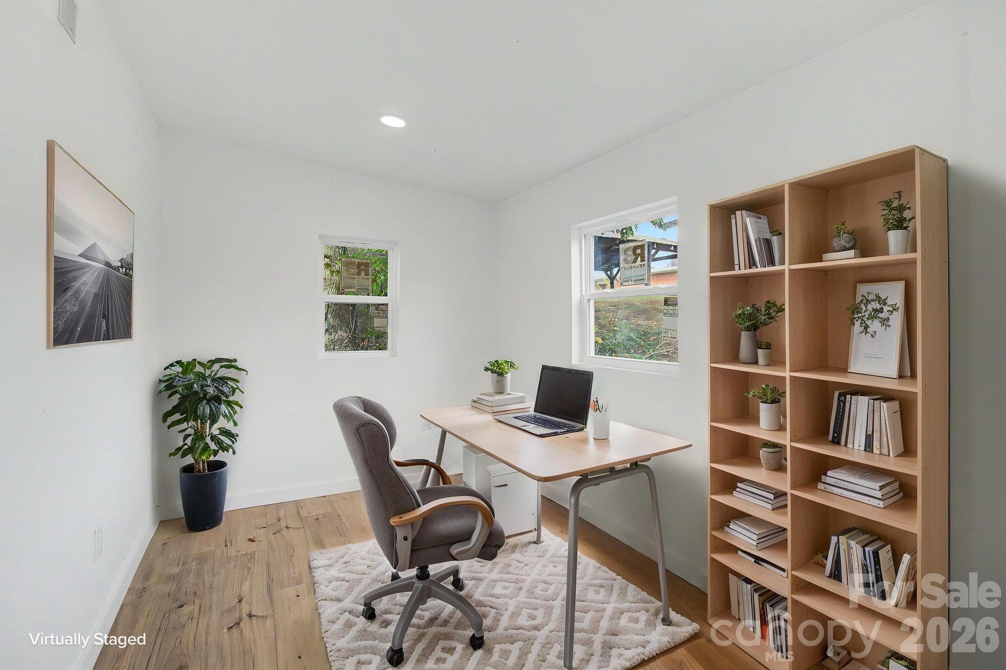 Bonus room off Primary bedroom perfect for an office.  Laundry closet is located in this room. AI staged photo - 14 Kirby Place, Asheville