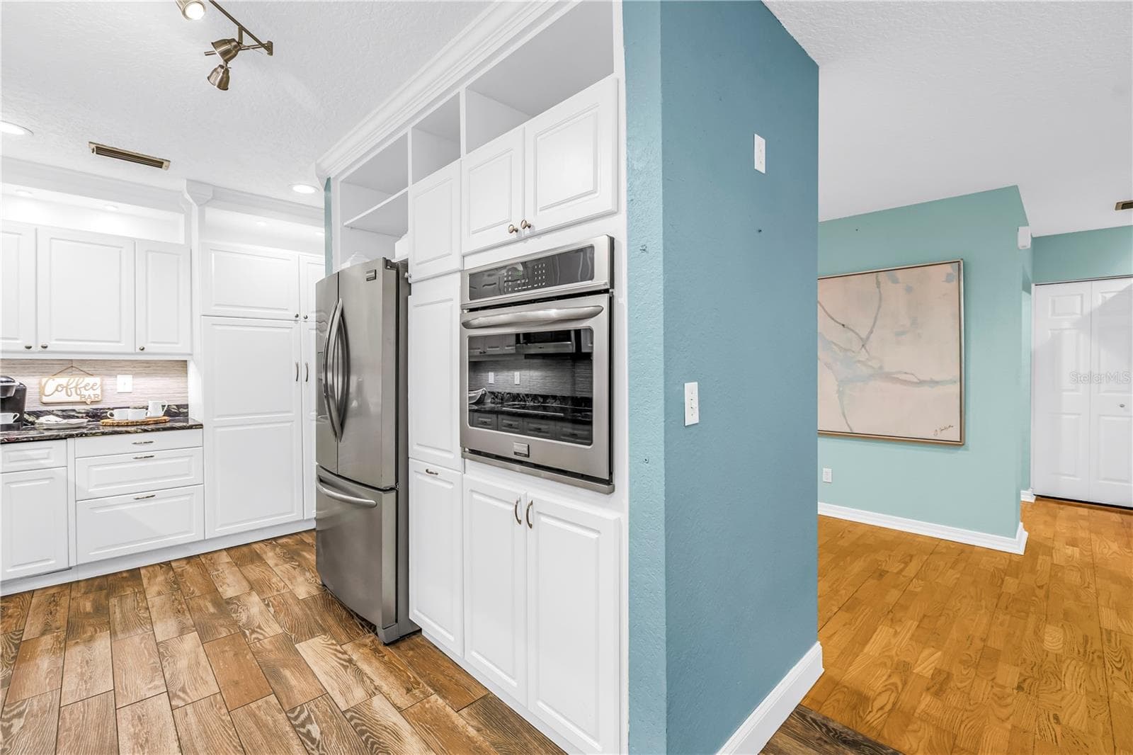 The separate kitchen console housing the refrigerator and wall oven provides added convenience and increased storage capacity. - 146 GIRALDA BLVD NE, ST PETERSBURG