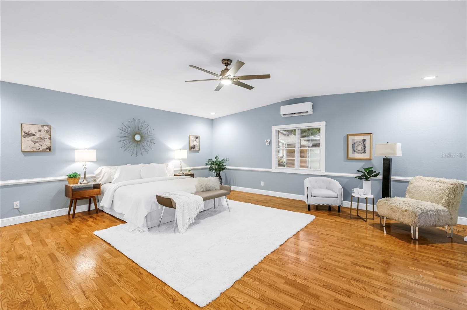 Primary Bedroom has window, French Doors to the pool and additional cooling for the perfect night's sleep.  Room also cooled by Central HVAC - 146 GIRALDA BLVD NE, ST PETERSBURG