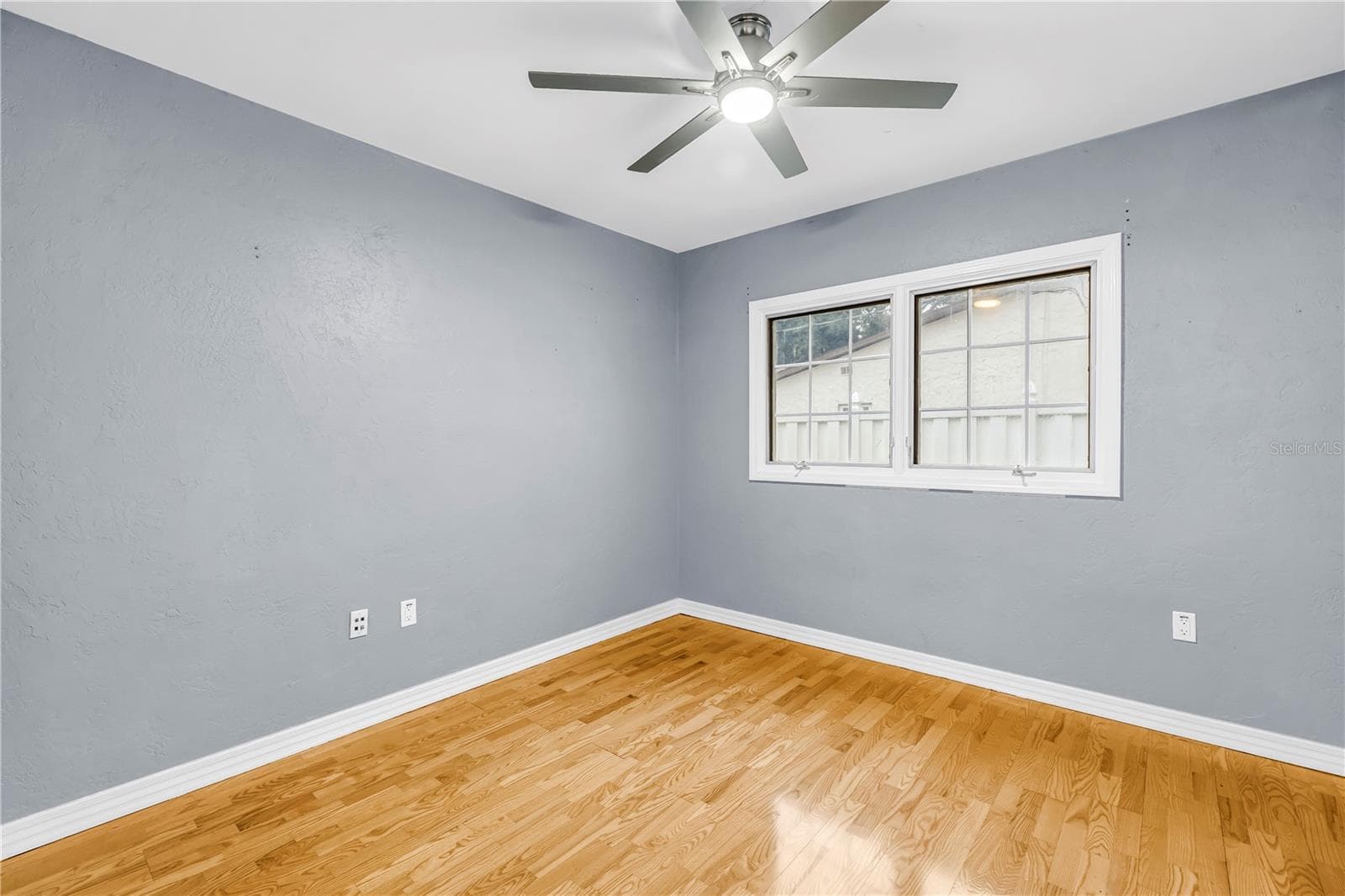 Third bedroom featuring a window and a large closet. - 146 GIRALDA BLVD NE, ST PETERSBURG
