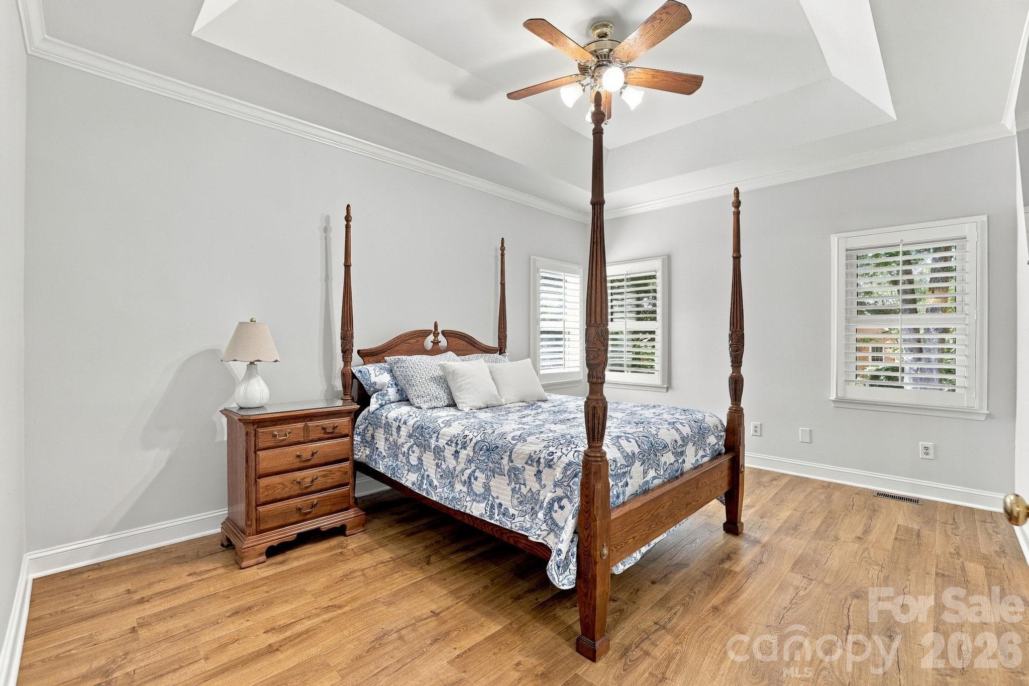 Primary Bedroom with Tray Ceiling and Laminate Floors1471 Porch Swing Lane Matthews, NC 28104 - 1471 Porch Swing Lane, Matthews