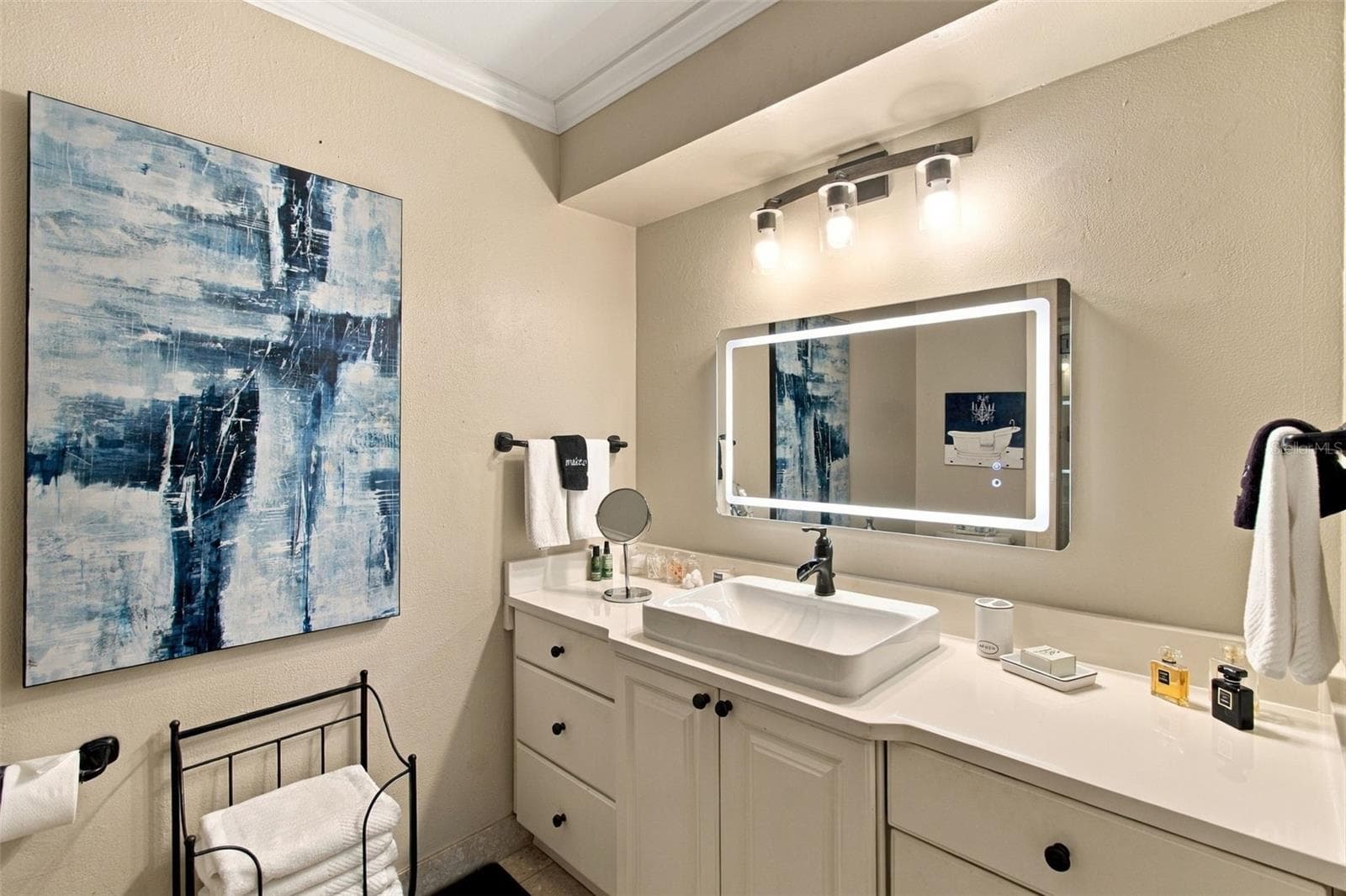 Guest bathroom - lighted mirror - 1921 MANOR CIR SE, WINTER HAVEN