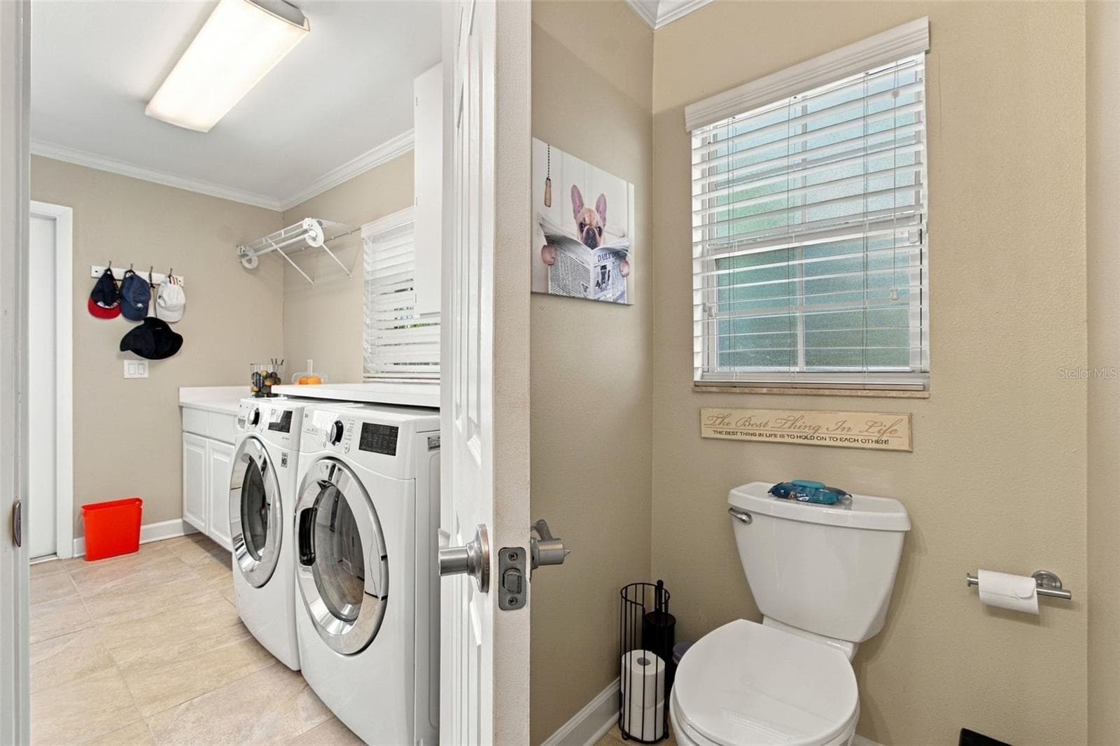 Laundry room & half bathroom - 1921 MANOR CIR SE, WINTER HAVEN