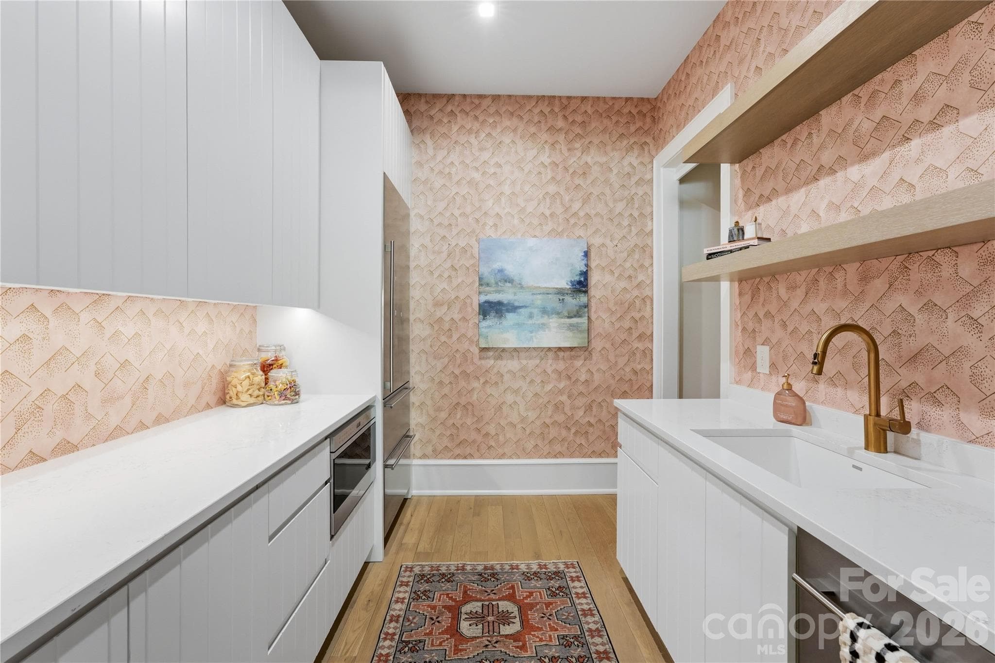 Scullery off the kitchen features a pantry, full size Sub Zero fridge/freezer, additional sink and Asko dishwasher, and drawer microwave. Pocket door entry to close off the mess if needed! - 2610 Sedley Road, Charlotte