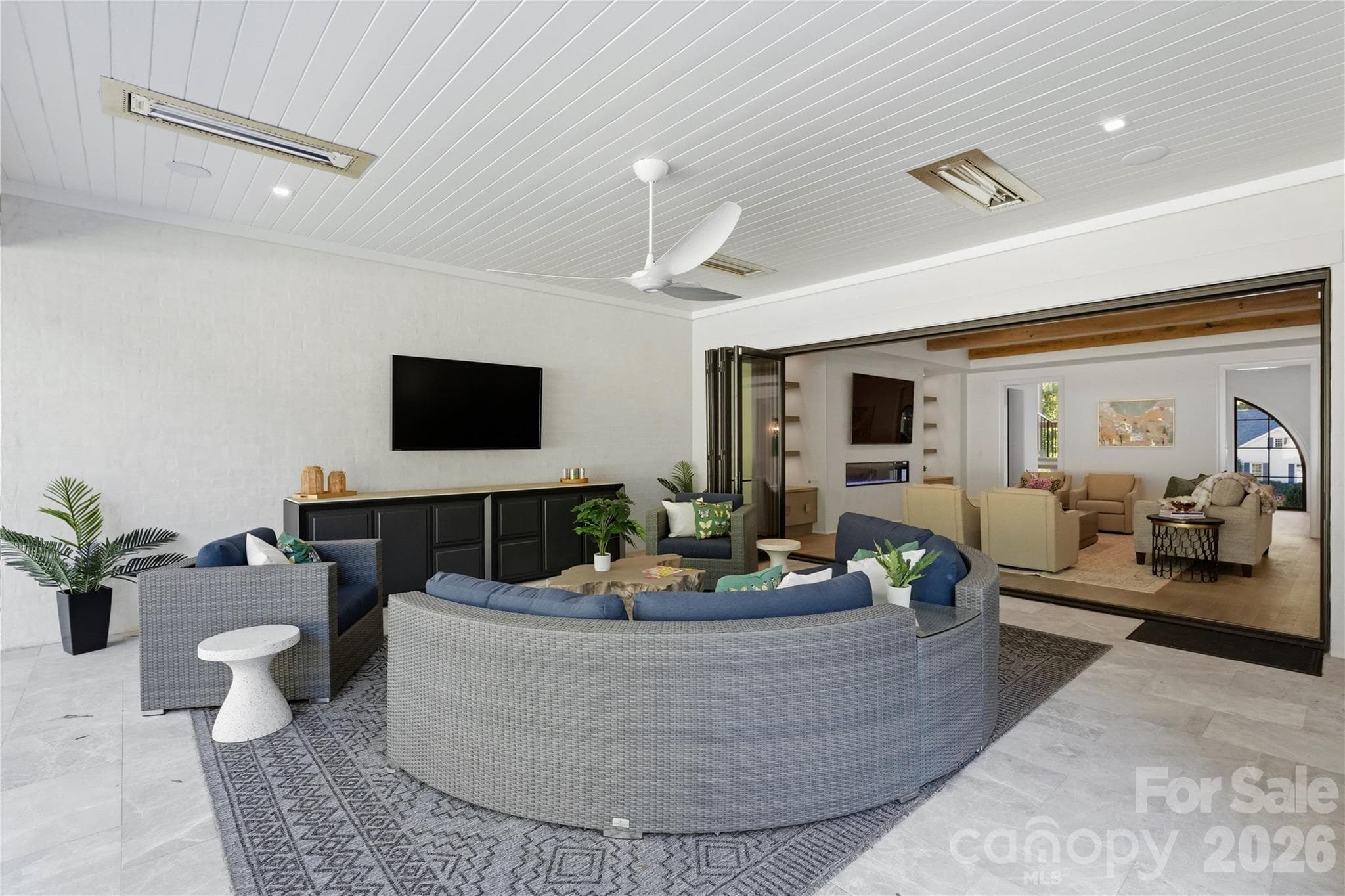 Accordion window wall between LR and covered porch opens to create an even larger area to entertain and enjoy indoor/outdoor living. - 2610 Sedley Road, Charlotte