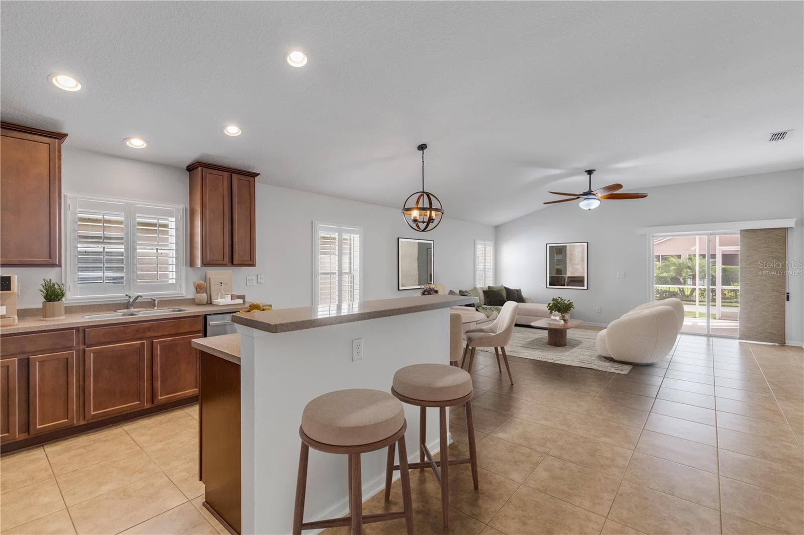 Virtually Staged kitchen with great flow to Family Room. - 3450 VELONA AVE, NEW SMYRNA BEACH