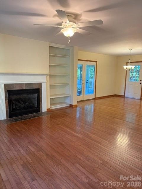 Spacious living room and dinette area with the furniture removed. - 22 Great Aspen Way, Black Mountain