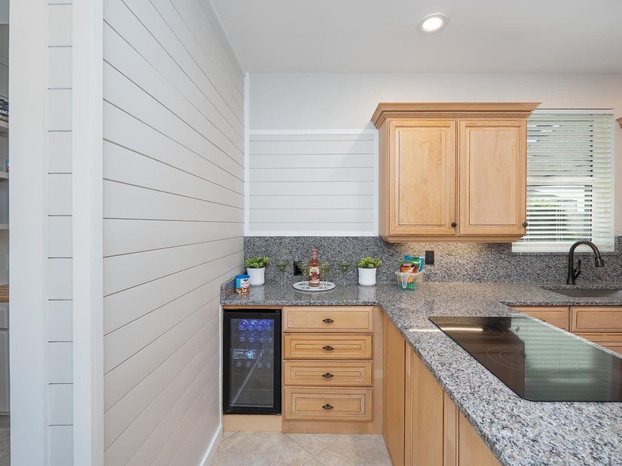 Wine frig in kitchen with pretty ship lap wall accent - 71 CAYMAN ISLES BLVD, ENGLEWOOD