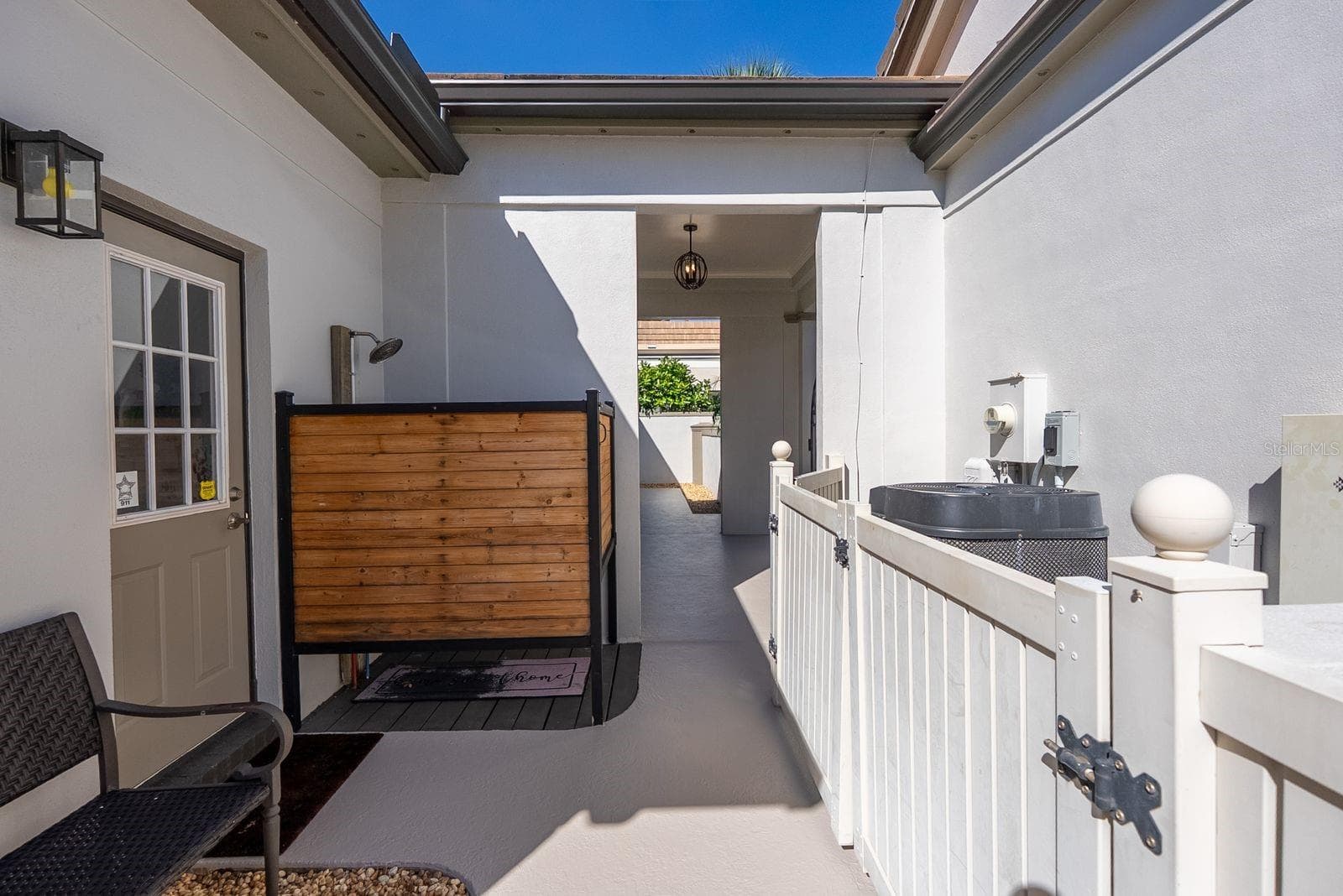 Outside shower by laundry room door on side of house - 71 CAYMAN ISLES BLVD, ENGLEWOOD