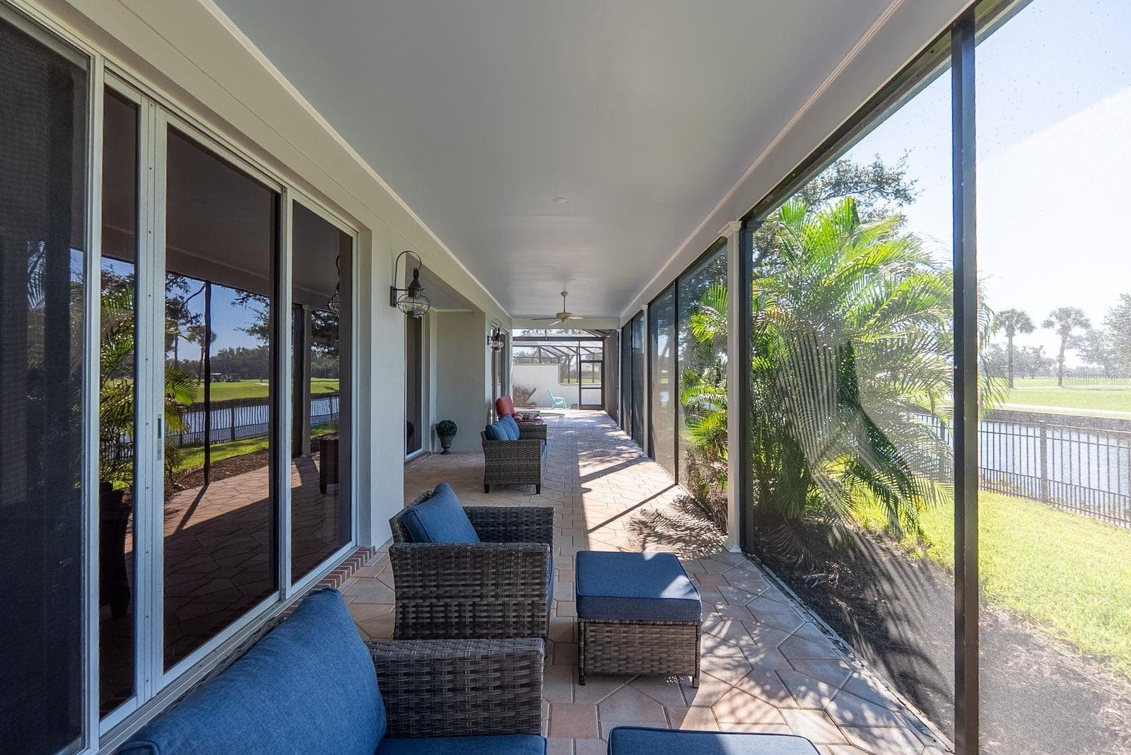 back covered patio just outside primary bedroom door - 71 CAYMAN ISLES BLVD, ENGLEWOOD