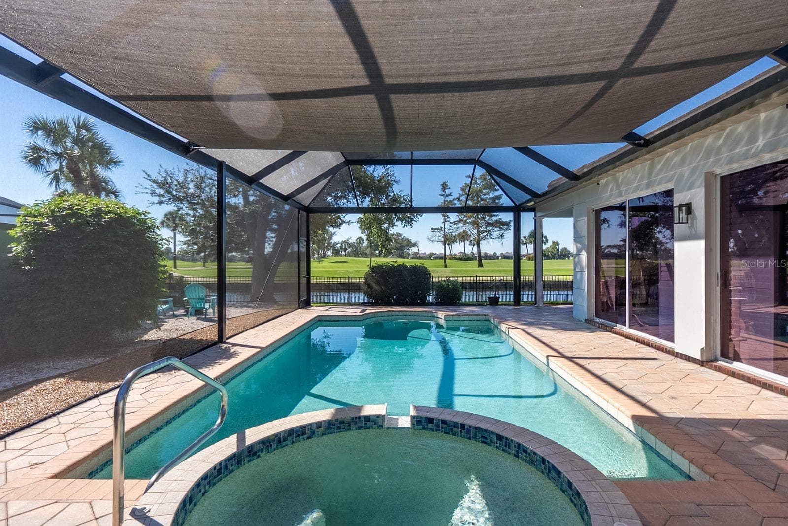 pool and spa overlooking pond and golf course - 71 CAYMAN ISLES BLVD, ENGLEWOOD