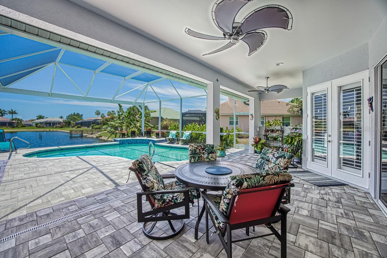 Covered lanai with hurricane protection - 8625 SOUTHWIND BAY CIR, FORT MYERS
