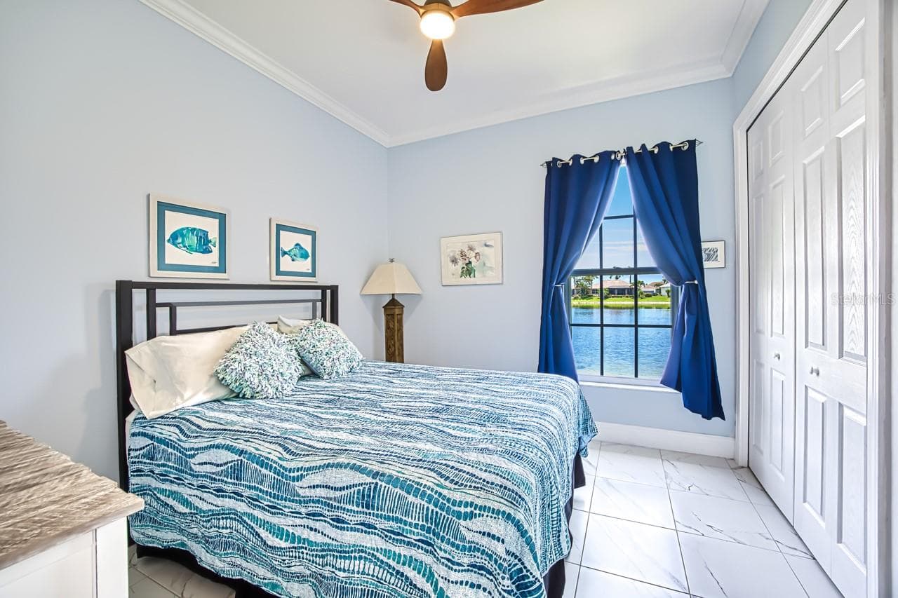 Guest Bedroom overlooking the lake - 8625 SOUTHWIND BAY CIR, FORT MYERS