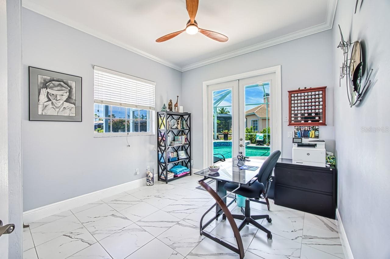 4th bedroom with hurricane french doors opening to pool area - also has fabric hurricane shutters for added protection - 8625 SOUTHWIND BAY CIR, FORT MYERS
