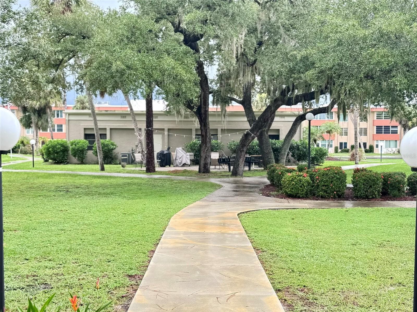 Path to courtyard with grills - 21280 BRINSON AVE #113, PORT CHARLOTTE