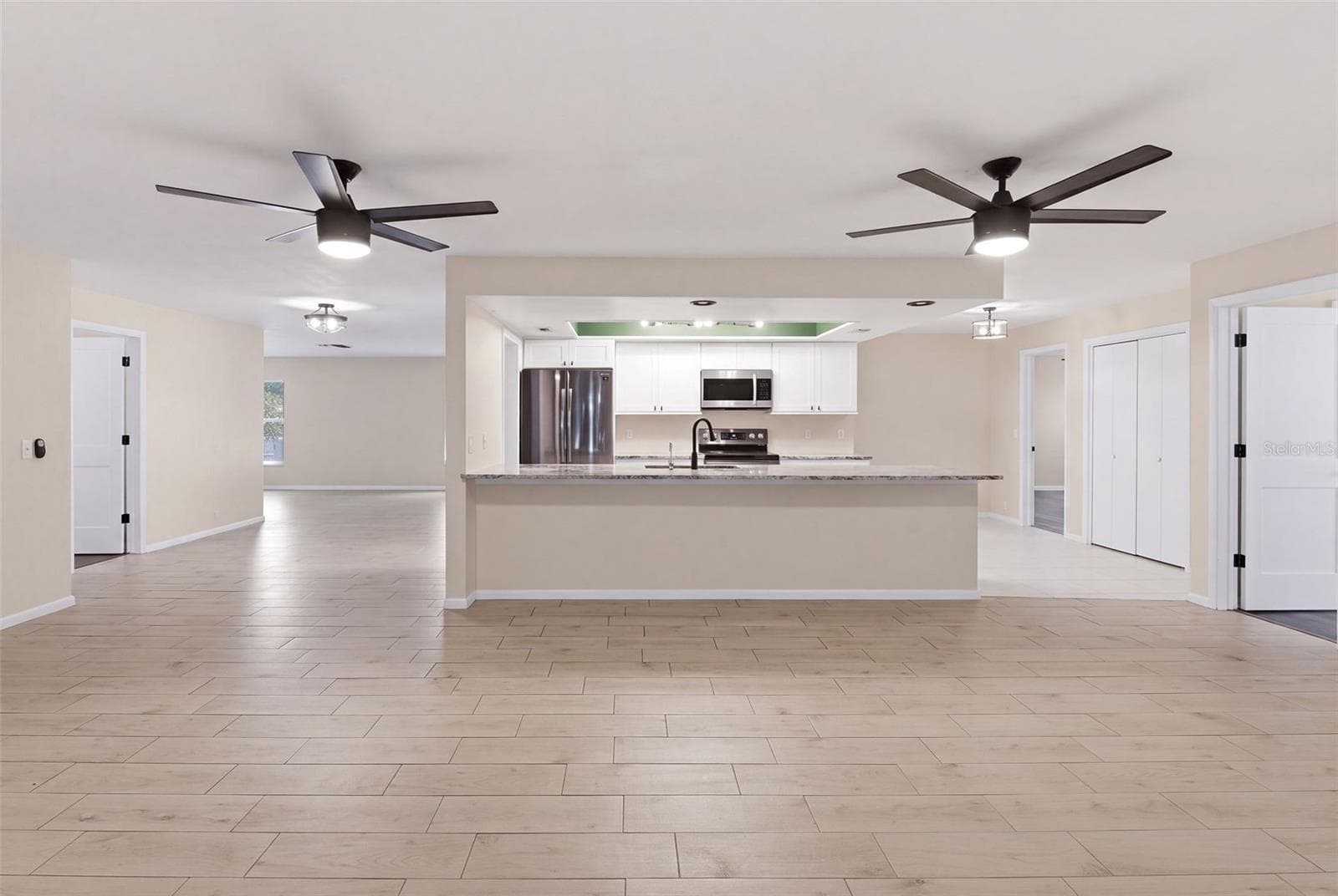 family room and kitchen - 998 DUMONT DR, DUNEDIN