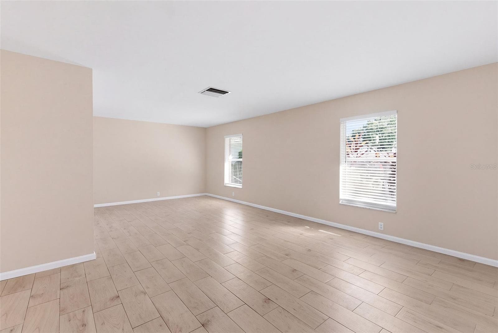 living room and dining area - 998 DUMONT DR, DUNEDIN
