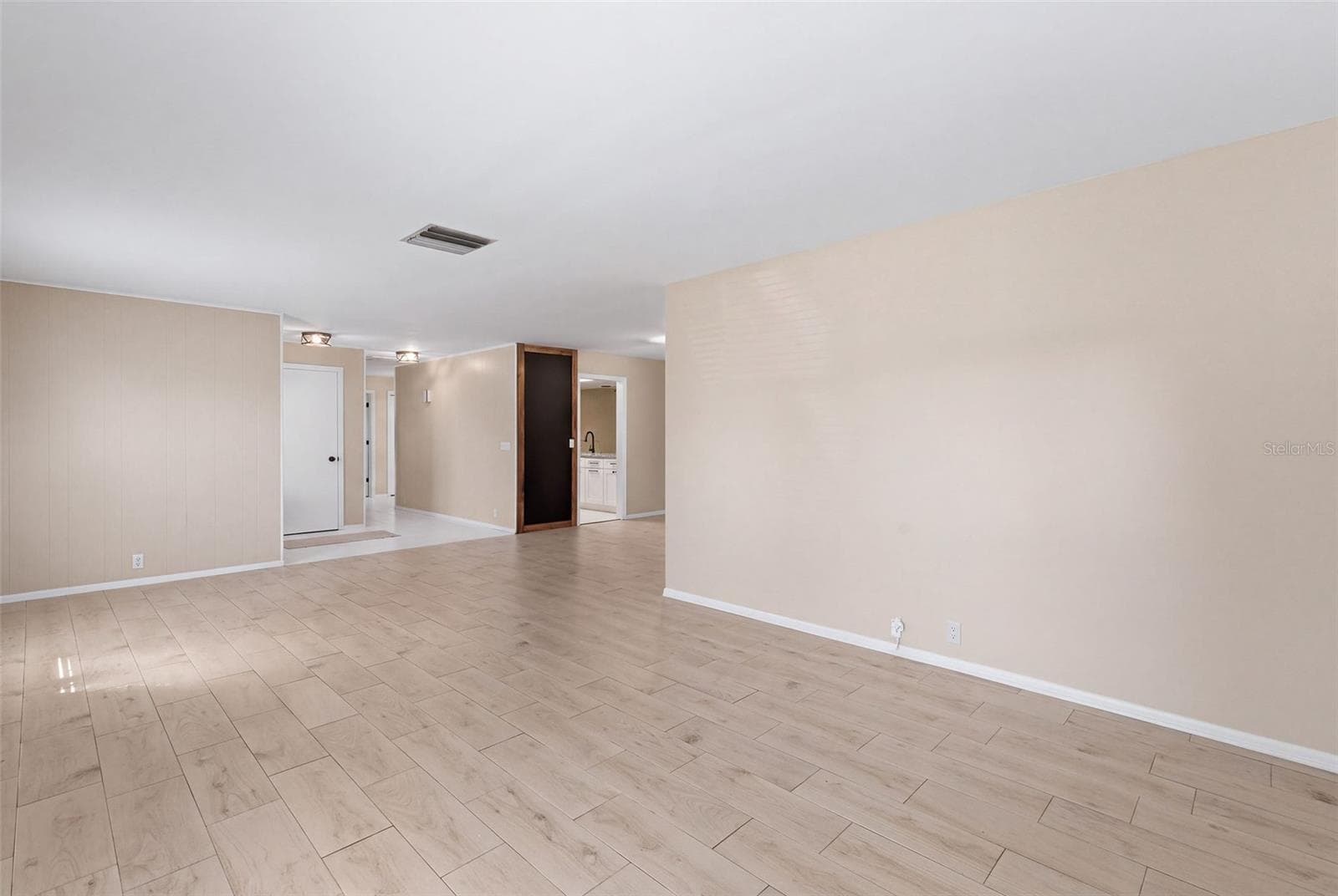 living room looking at dining area - 998 DUMONT DR, DUNEDIN