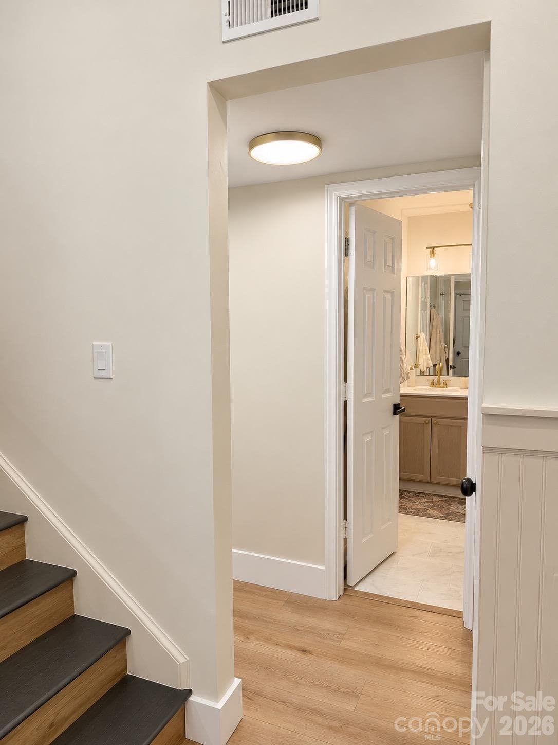Main Floor bathroom is connected to the primary bedroom - 11101 Sevilla Court, Charlotte
