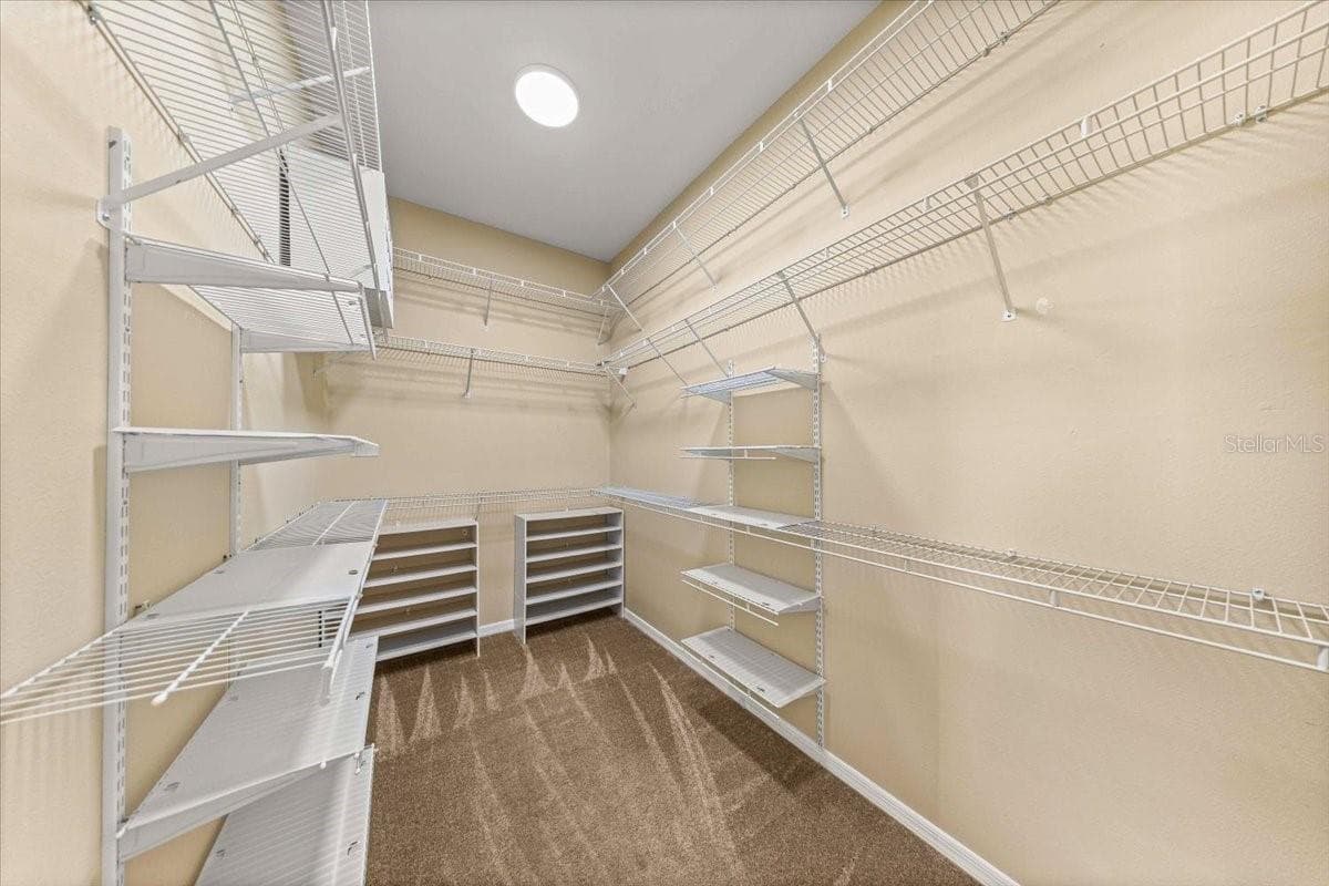 Primary Walk-In Closet - 5592 NE 61ST AVENUE RD, SILVER SPRINGS