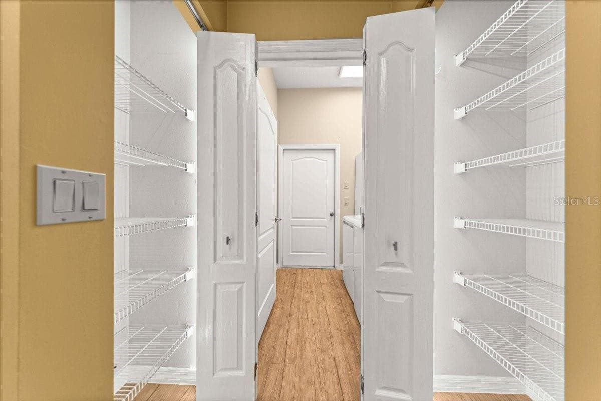 2 Pantries leading to Laundry Room - 5592 NE 61ST AVENUE RD, SILVER SPRINGS