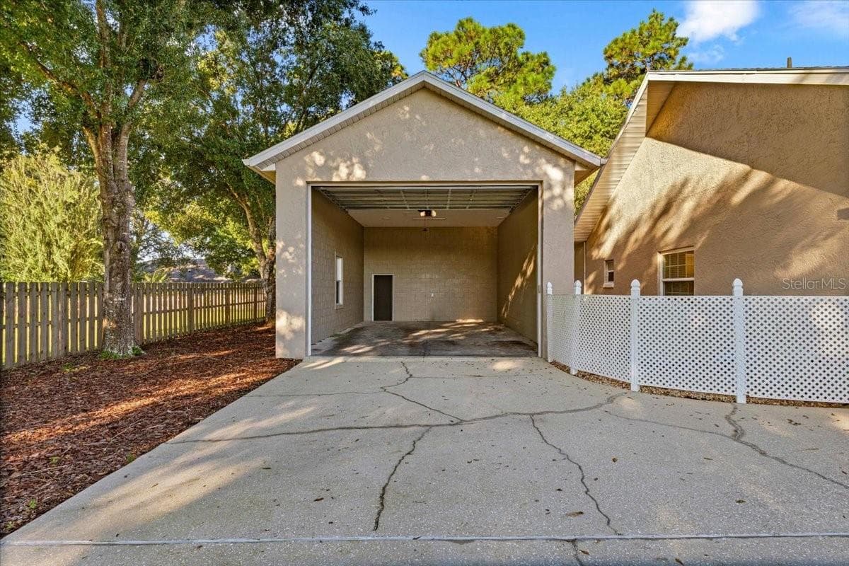 20'x32' Oversized Garage with 12 foot automatic door - 5592 NE 61ST AVENUE RD, SILVER SPRINGS