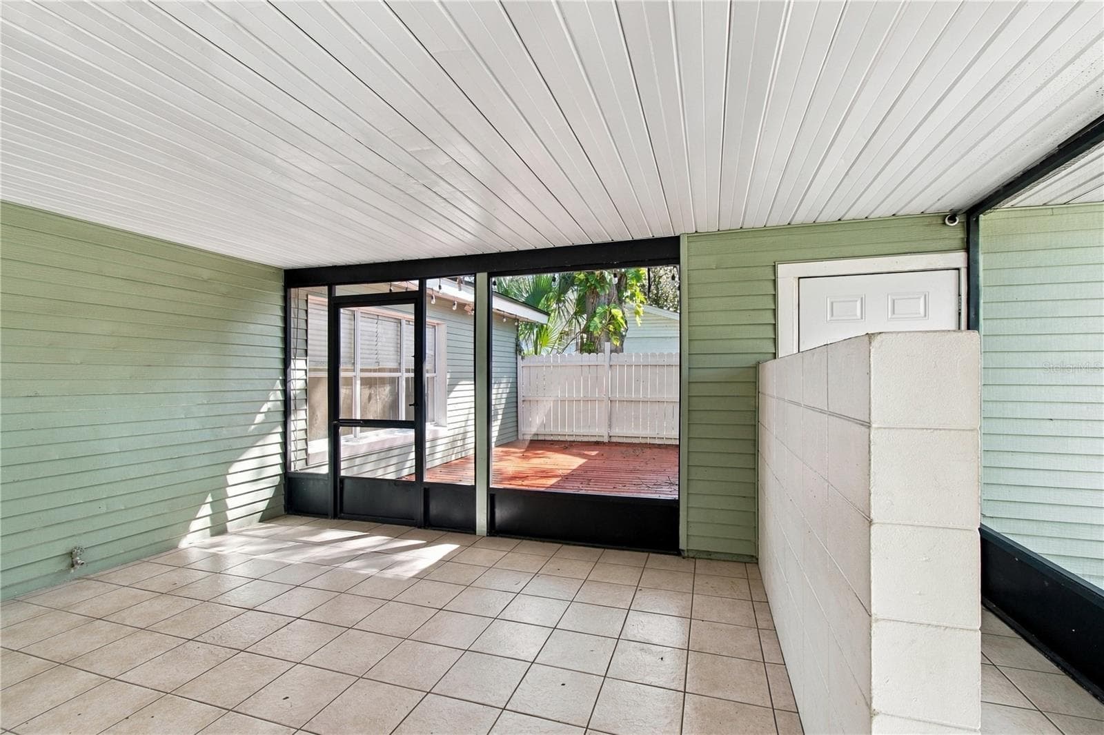 Patio overlooking deck and garage access on right side - 10312 LAKE CARROLL WAY, TAMPA
