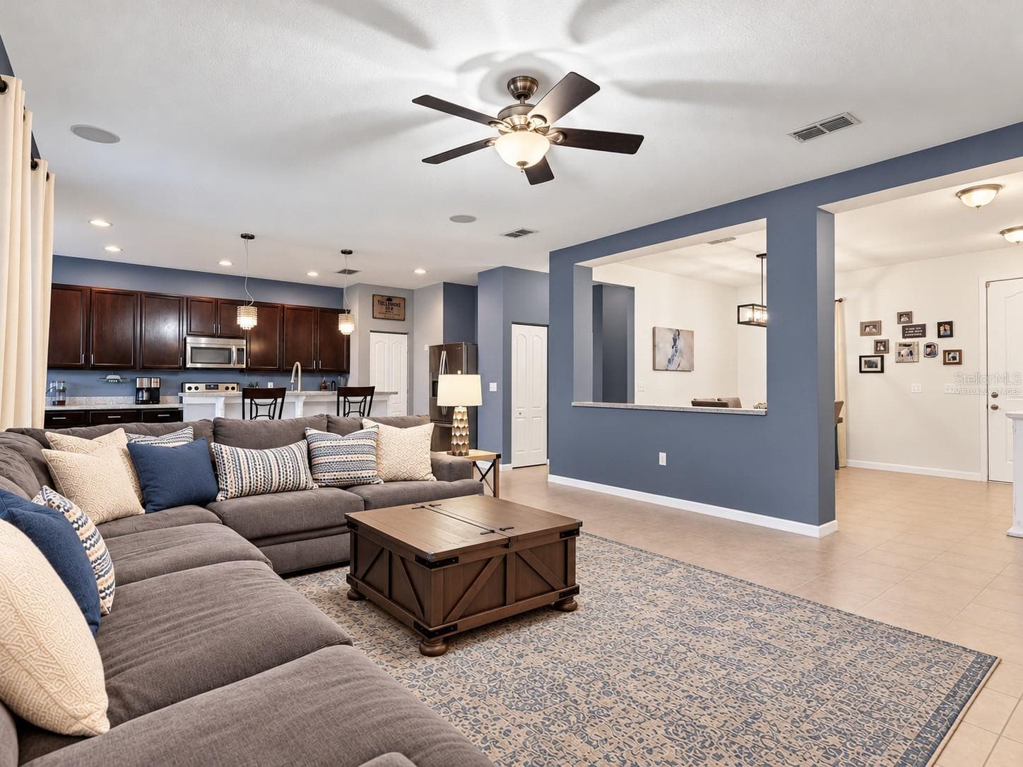 Virtually staged, view from living room to front door/dining room - 6307 4TH ST E, BRADENTON
