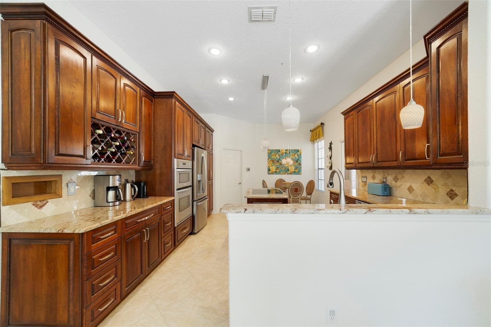 Wood cabinets with plenty of storage - 3514 OCITA DR, ORLANDO