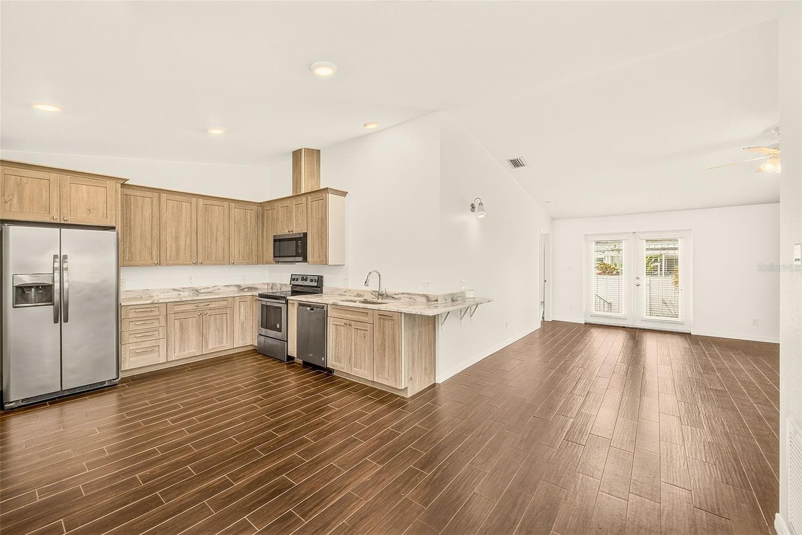 Kitchen is open to the living room - 14330 CHANNEL DR, LARGO