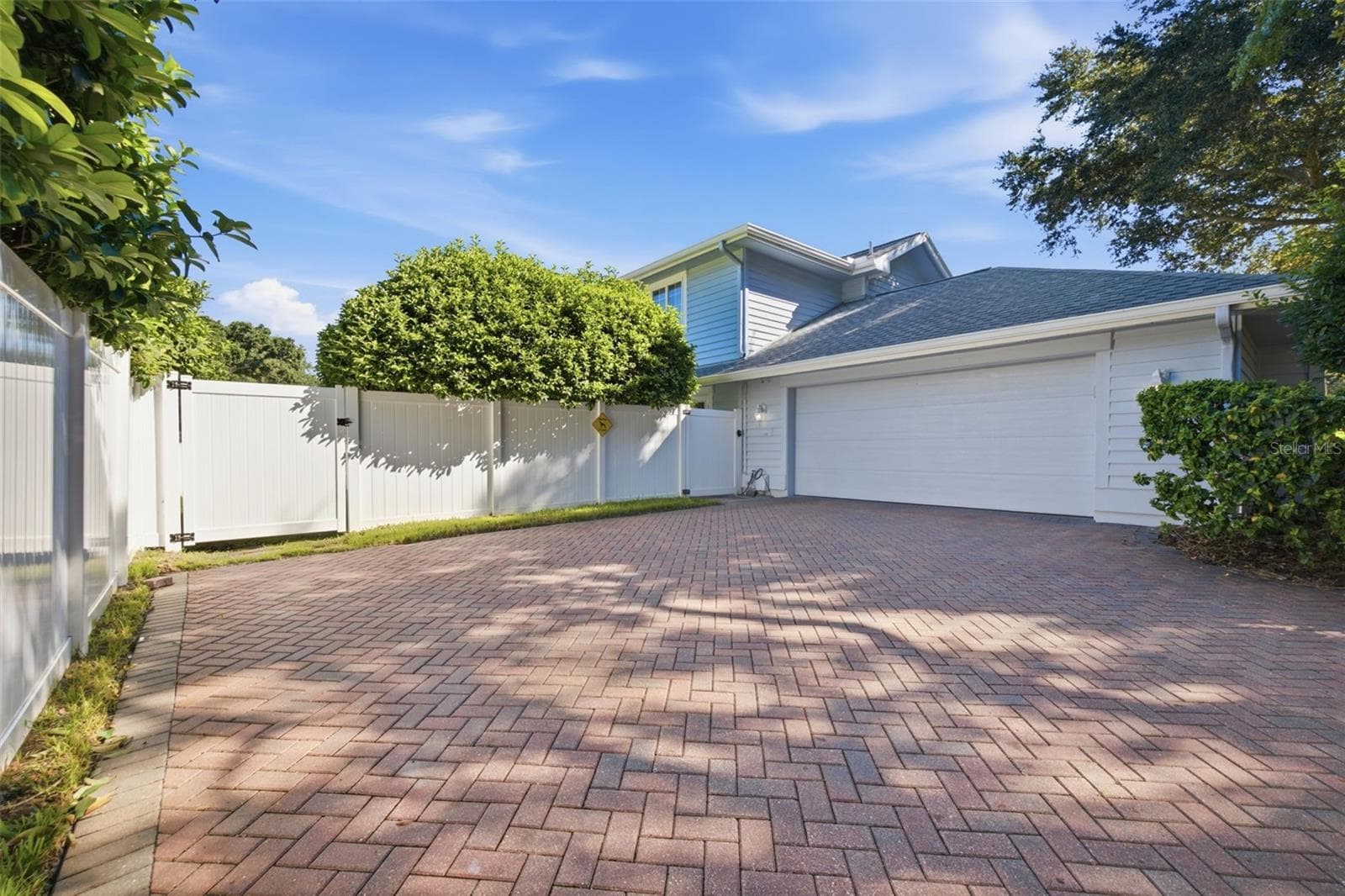 Two Car Garage with Side Entry, allows for additional parking. Concrete Paver Driveway - 12383 WINDTREE BLVD, SEMINOLE