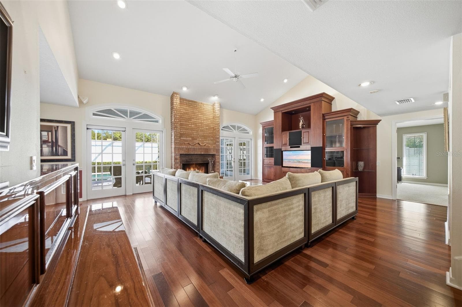 Family Room with views to the enclosed pool area. - 12383 WINDTREE BLVD, SEMINOLE