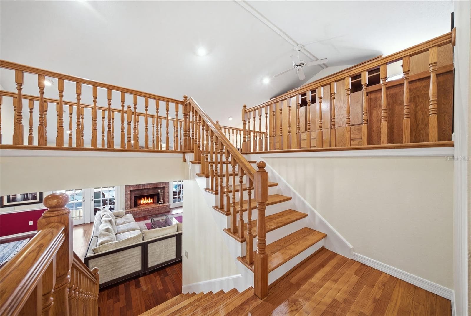 Mid-Floor landing wood staircase. - 12383 WINDTREE BLVD, SEMINOLE