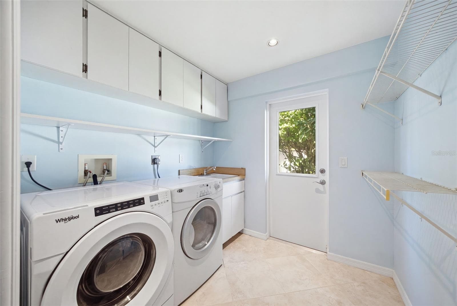 Laundry Room with Storage and Exterior Exit. - 12383 WINDTREE BLVD, SEMINOLE