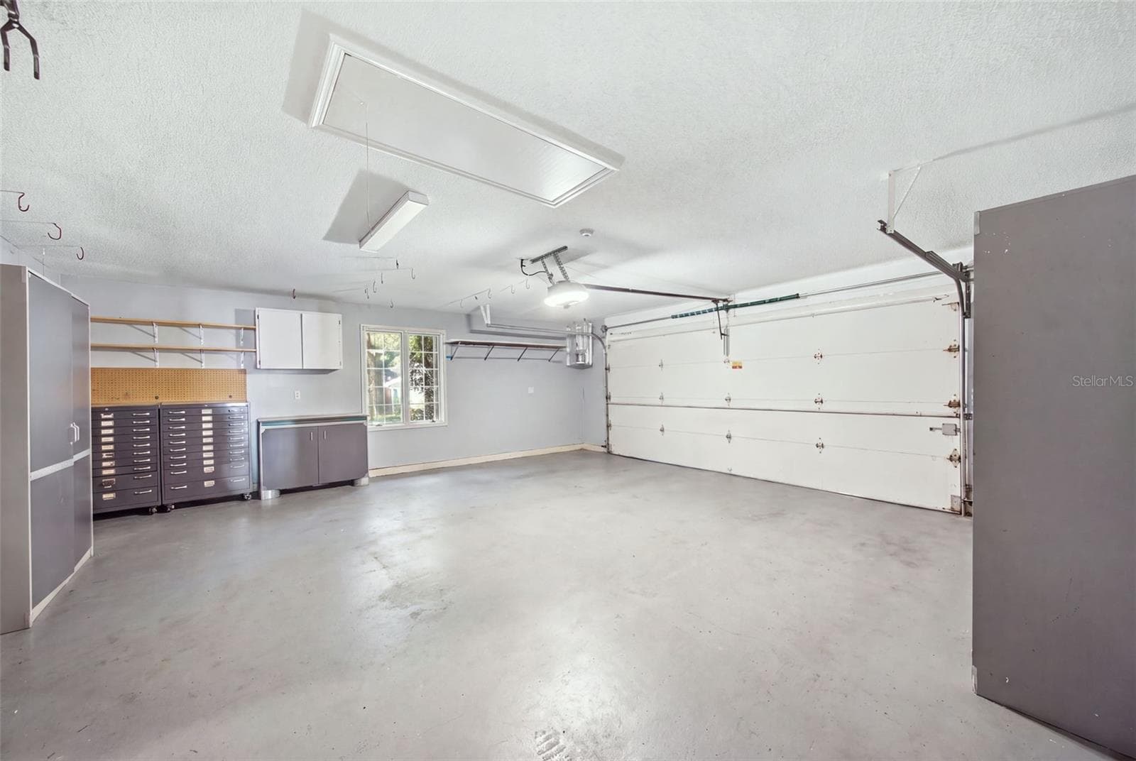 Two Car Garage with Built-in Storage - 12383 WINDTREE BLVD, SEMINOLE
