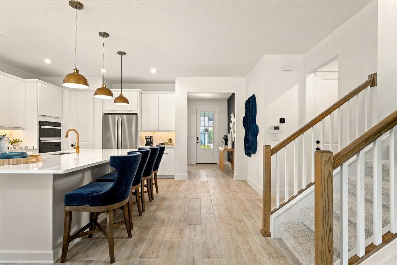 Meridian Parks Olympic Model Foyer, Kitchen and Stairs - 12534 MARITIME ST, ORLANDO