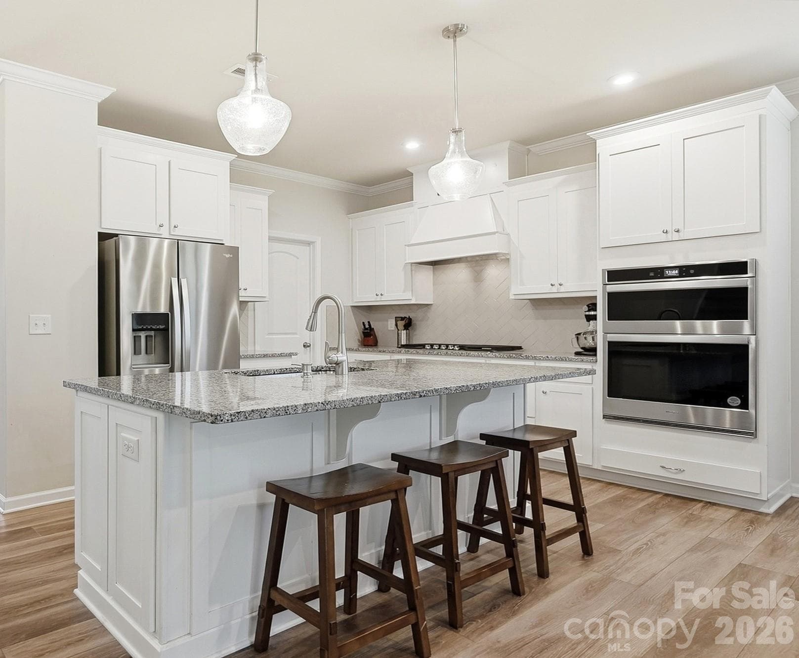 Chef's Upgraded Gourmet Kitchen with Wall Oven, Gas Stove Top and Vent - 1403 Laggan Lane, Indian Trail