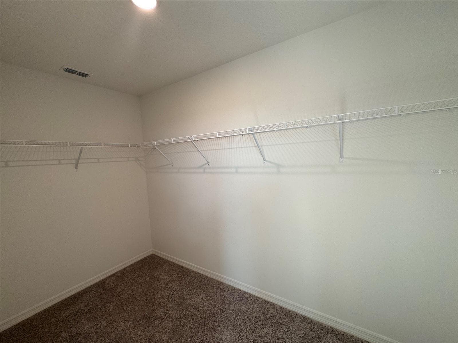 Primary walk-in closet - 3286 VICEROY CT, POINCIANA