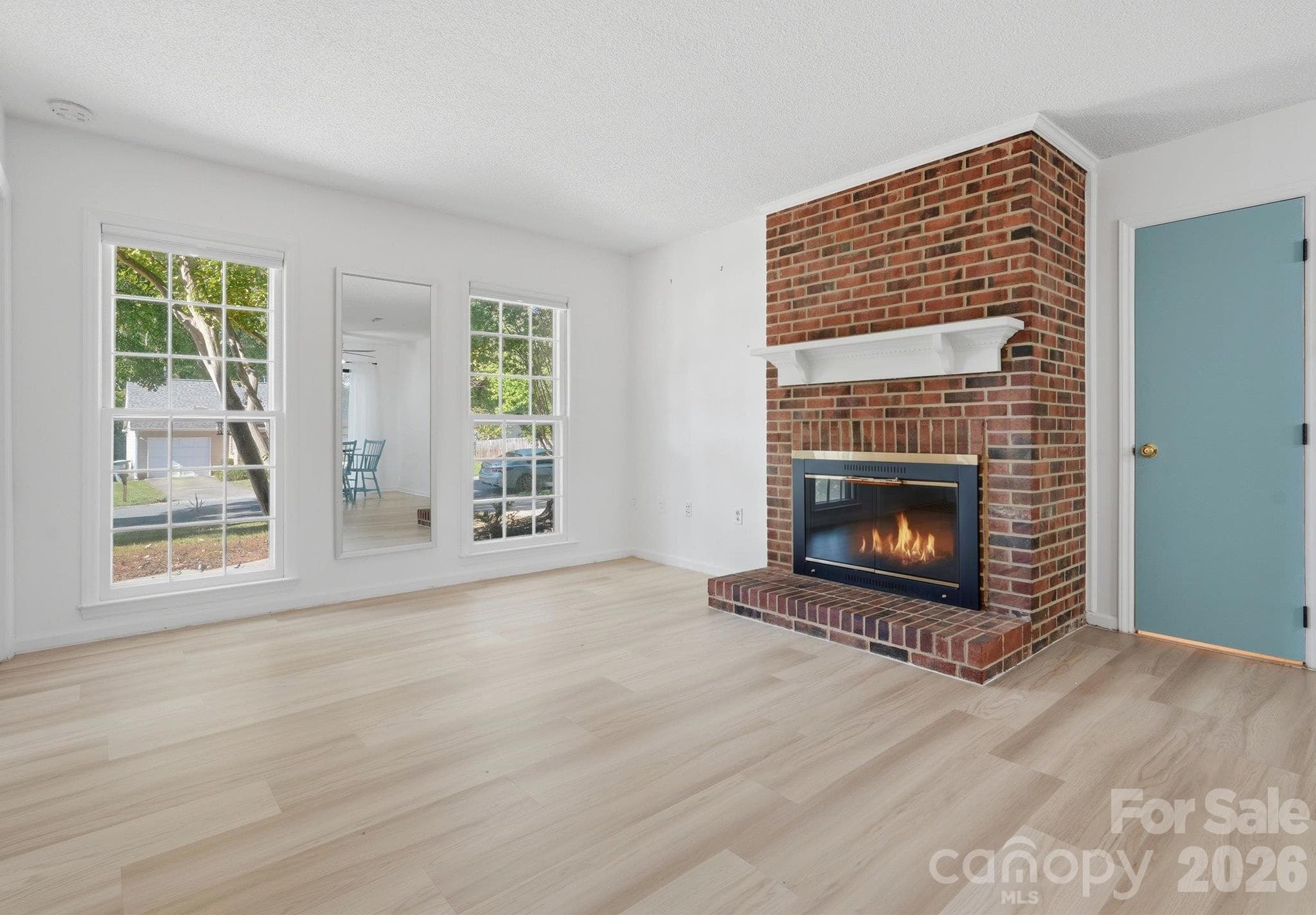 Living Room with Fireplace - 7214 Falconwood Court, Charlotte