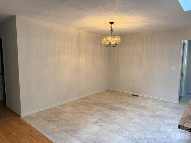 Dining area, lighting from the rattan chandelier reflects shadows on wall - 177 Natural Trail, Sylva