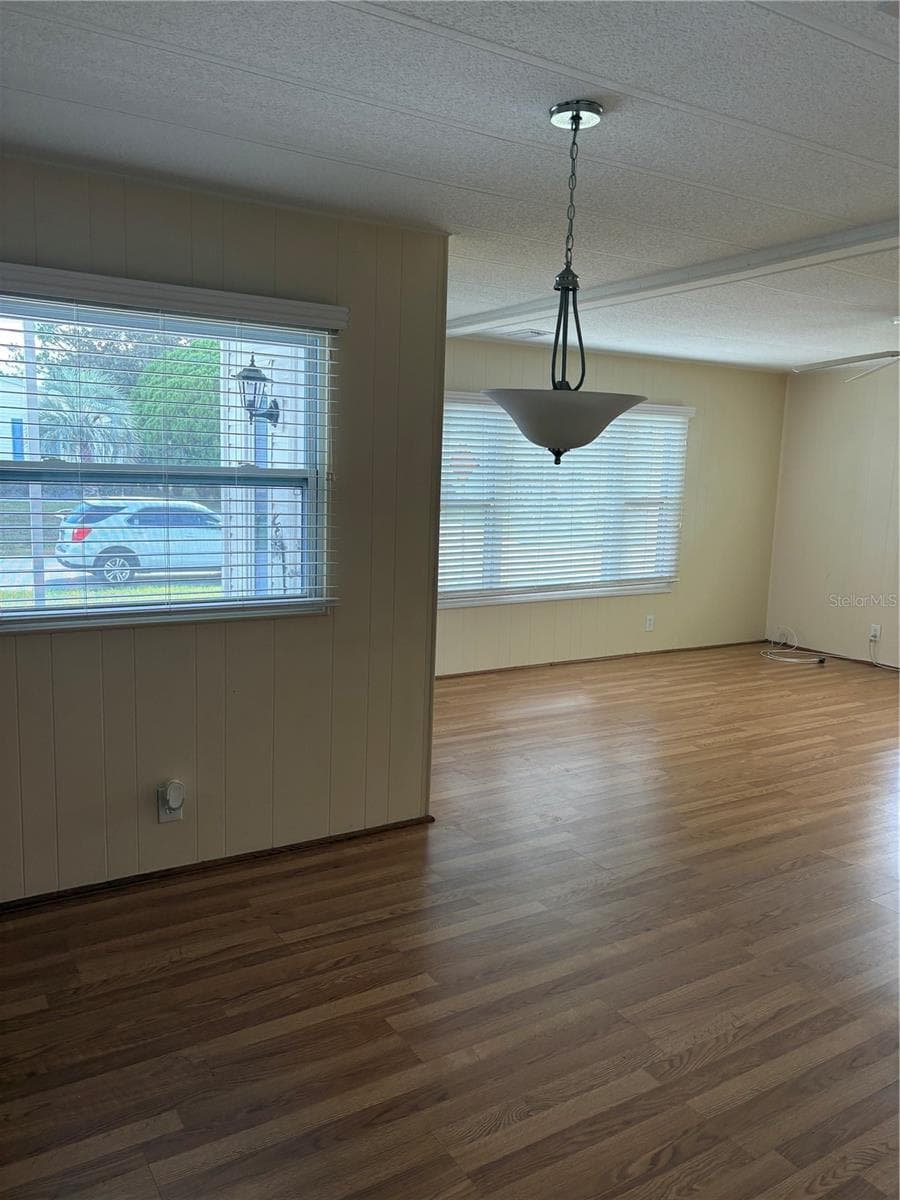 View from dining room into living room - 7507 DINSMORE ST, BROOKSVILLE
