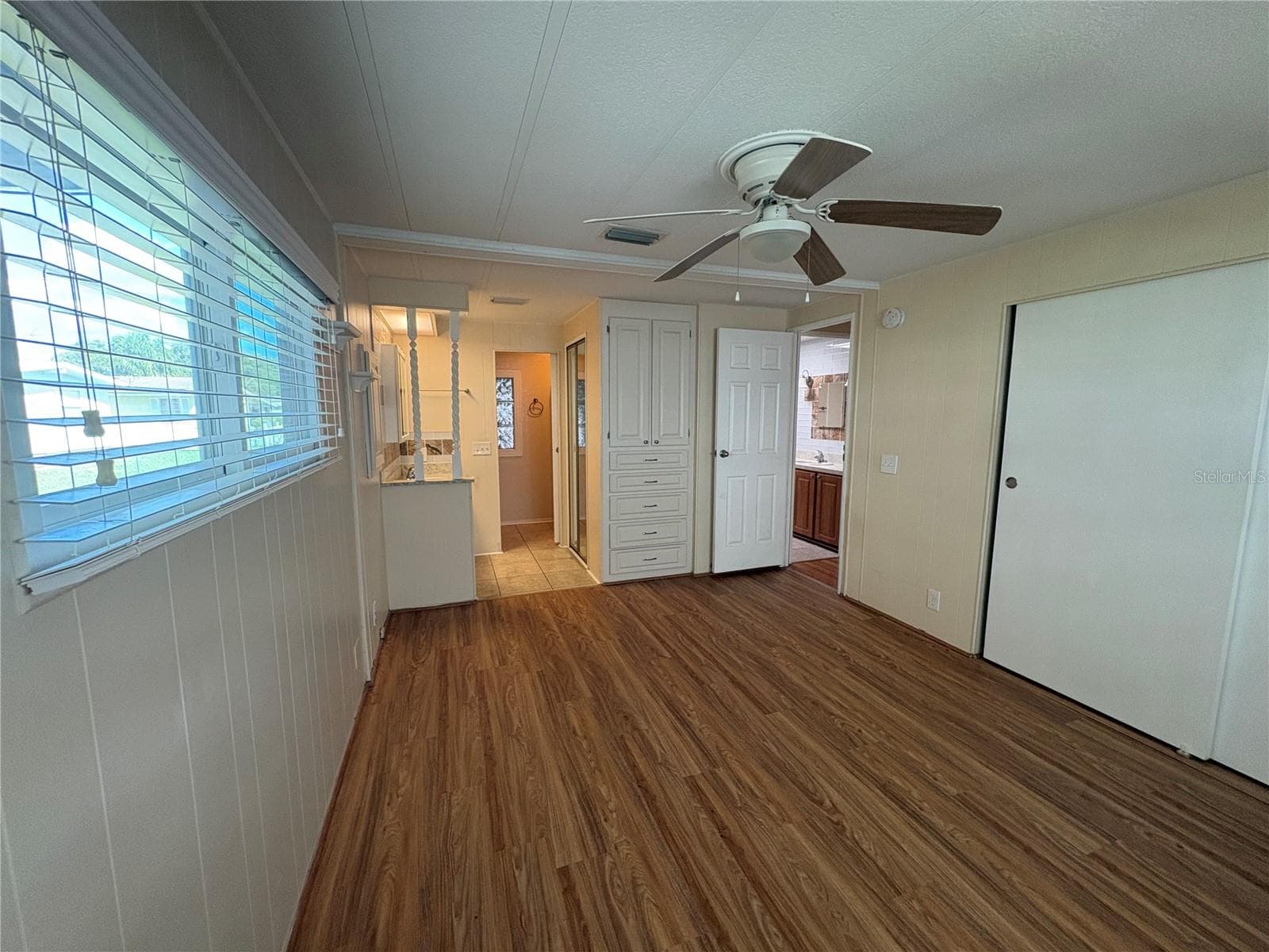Primary Bedroom toward ensuite bathroom - 7507 DINSMORE ST, BROOKSVILLE