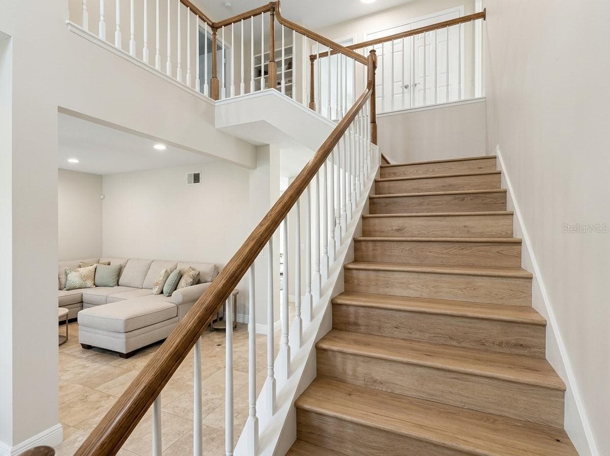 Staircase view looking up to the second floor. - 7866 BARDMOOR HILL CIR, ORLANDO