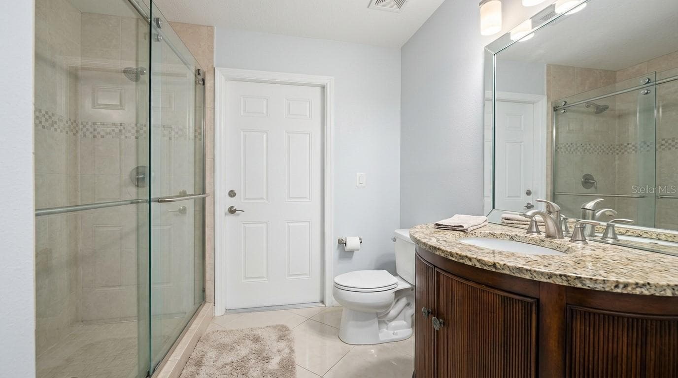Spacious full bathroom featuring modern fixtures and finishes. - 7866 BARDMOOR HILL CIR, ORLANDO