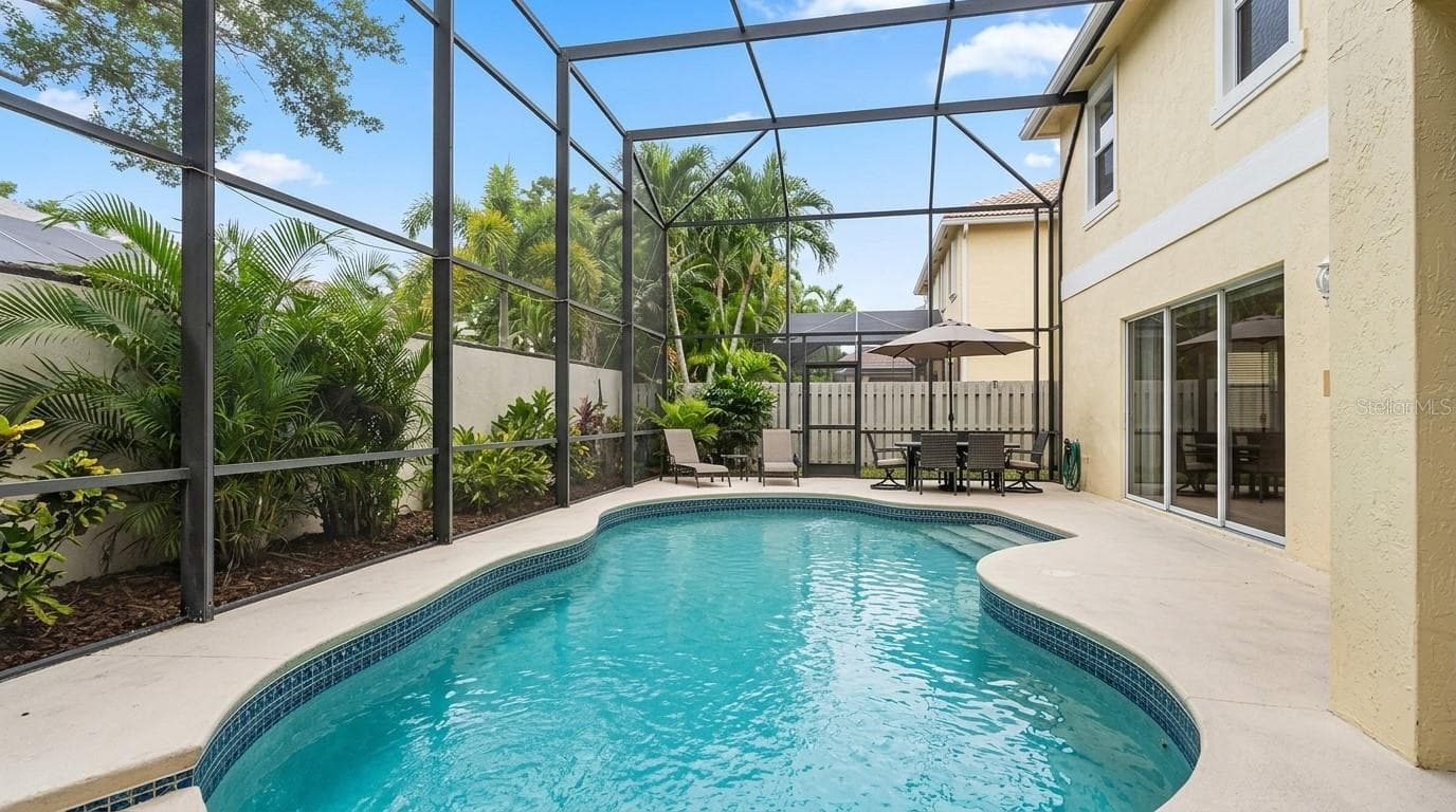 Spacious pool area viewed from the patio entrance. - 7866 BARDMOOR HILL CIR, ORLANDO