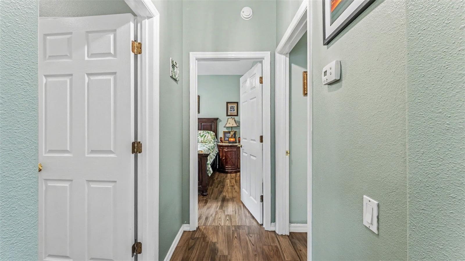 hallway to 3rd and 4th bedrooms - 6626 ROYAL FOREST DR, LAKELAND